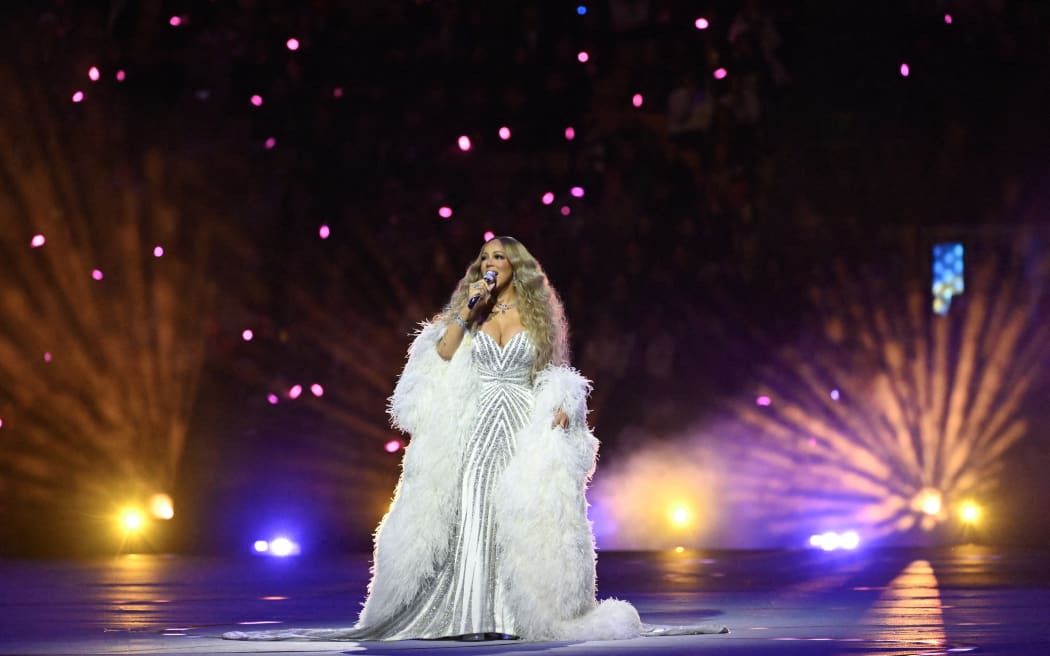 US singer Mariah Carey performs during the opening ceremony of the Milano Cortina 2026 Winter Olympic Games at the San Siro stadium in Milan, northern Italy, on February 6, 2026. (Photo by WANG Zhao / AFP)