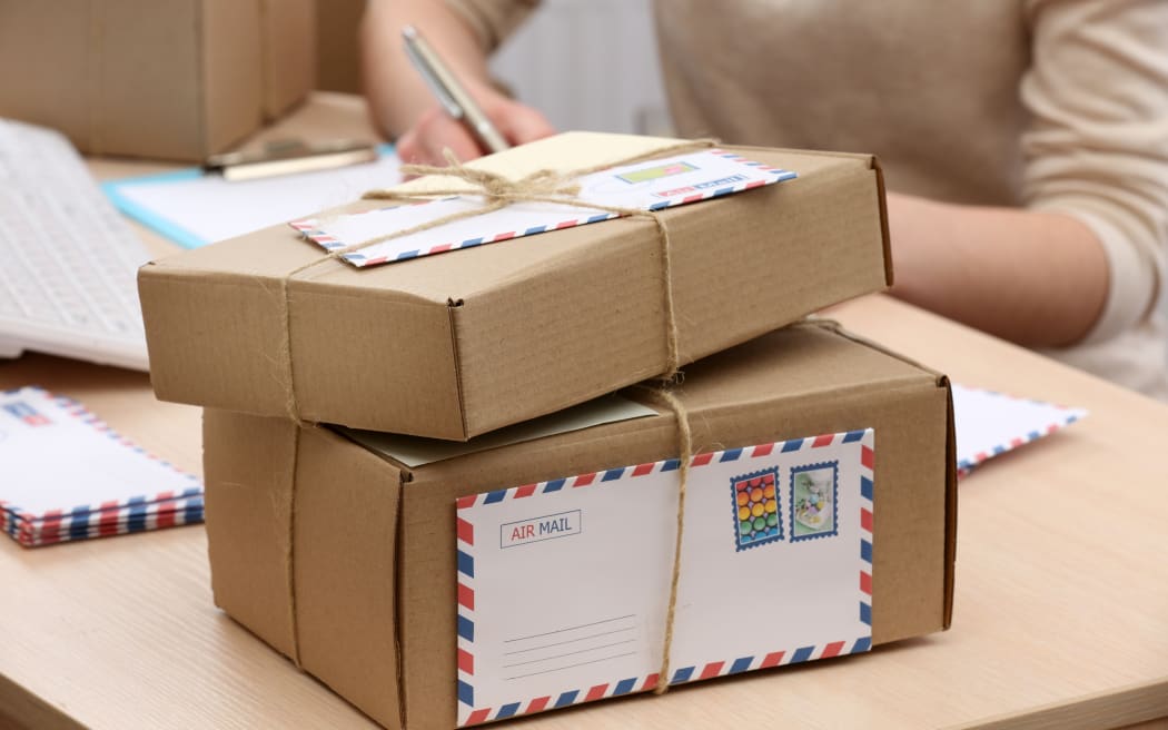 Cardboard boxes on work place in post office