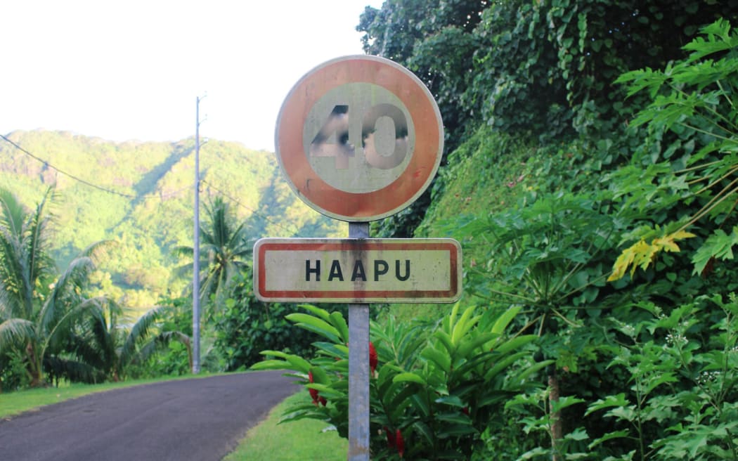 A sign announcing the town of Haapu on the the Tahitian island Huahine