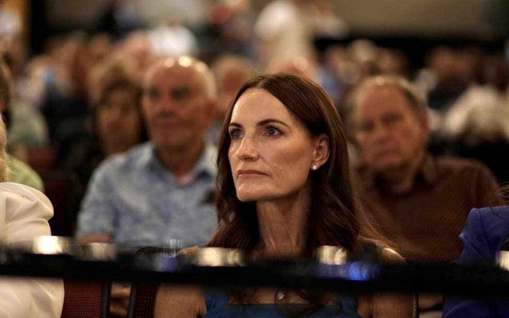 Amanda Luxon watches as her husband, Prime Minister Christopher Luxon, gives the State of the Nation speech.