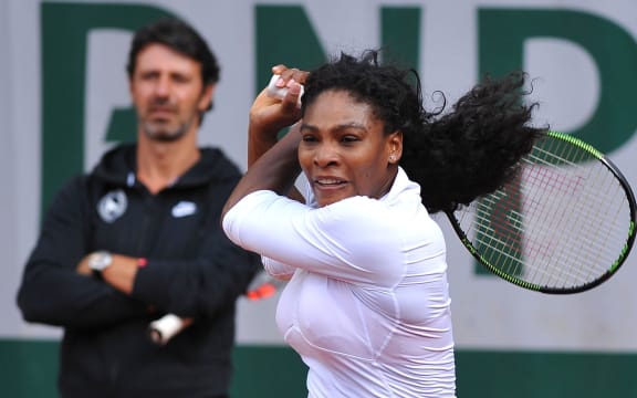 Serena Williams trains under the watchful eye of coach Patrick Mouratoglou.