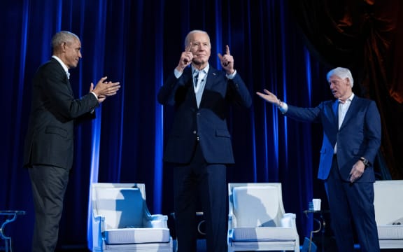 Former US President Barack Obama (L) and former US President Bill Clinton (R) cheer for US President Joe Biden during a campaign fundraising event at Radio City Music Hall in New York City on March 28, 2024. (Photo by Brendan Smialowski / AFP)