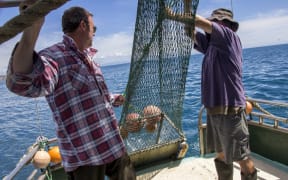 Karl Warr came up with the idea for attaching a cage to the back of a net to allow smaller fish to swim free.