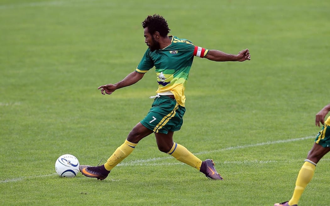 Lae City Dwellers' captain Raymond Gunemba scores the opening goal against Malampa Revivors.