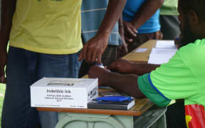 Indelible ink is used at a polling booth in Papua New Guinea's national election.