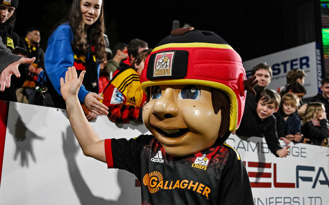 Chiefs mascot with fans and supporters.
