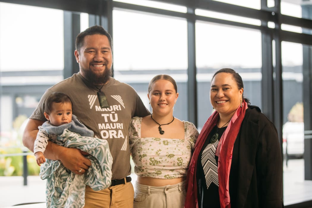 Michael Moka and his wife Tōria with their son Raukura O Te Huia, with the scholar they are supporting through First Foundation, Ella Harre.