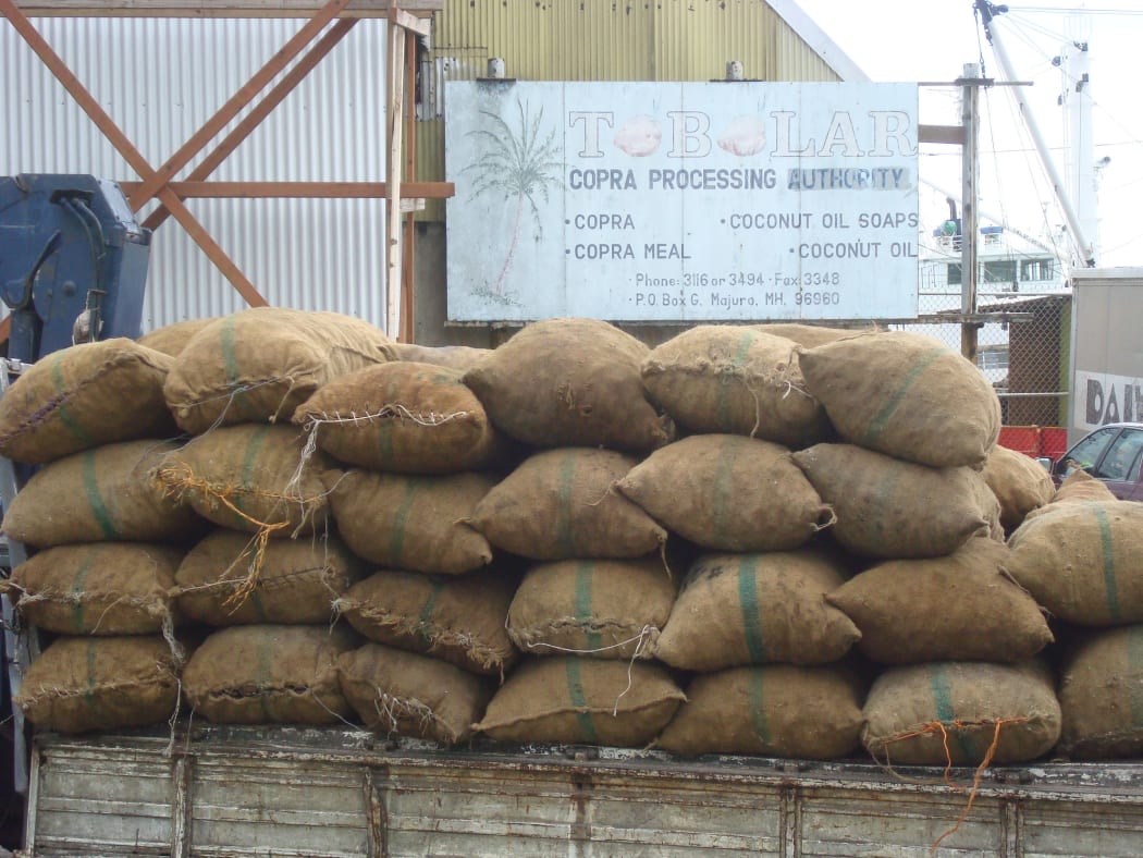 Bags of copra stacked for weighing at the Tobolar Copra Processing Authority milling plant in Majuro