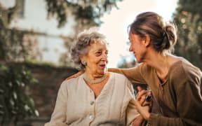 an older woman with a younger woman