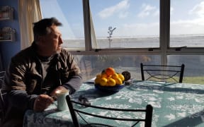 David Zimmerman of East Beach wants a seawall built to keep the local homes from being washed away.