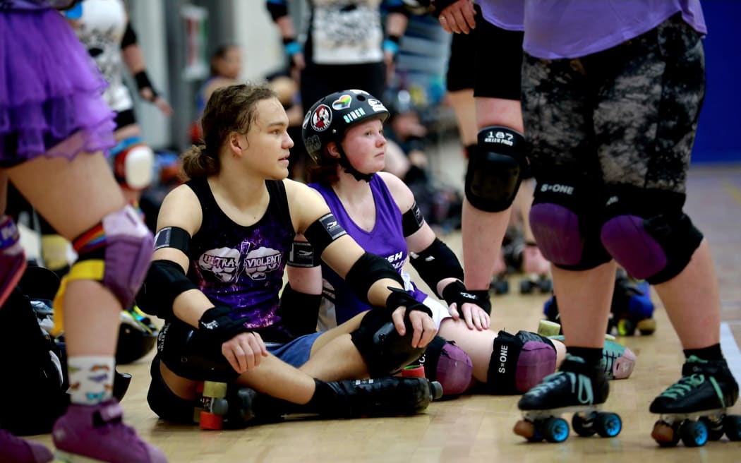 A pause in the action at the roller derby at the Rainbow Games.