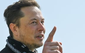 US entrepreneur and business magnate Elon Musk gestures during a visit at the Tesla Gigafactory plant under construction, on August 13, 2021 in Gruenheide near Berlin, eastern Germany. (Photo by Patrick Pleul / POOL / AFP)