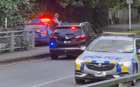 Police at one of the cordons on the corner of Nile St and Domett St in central Nelson during an armed standoff with a man on Thursday.