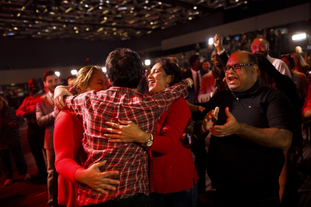 Liberal supporters react as they watch results roll in at Canadian Prime Minister Justin Trudeau's election night headquarters.