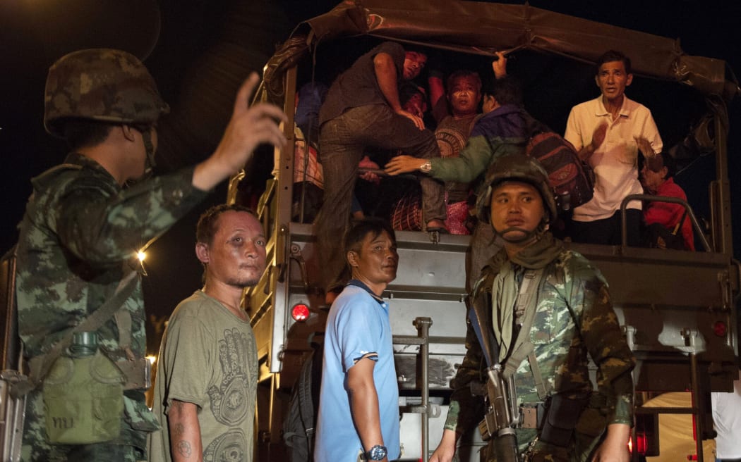 'Red Shirt' activists leave the protest rally venue on an army truck.