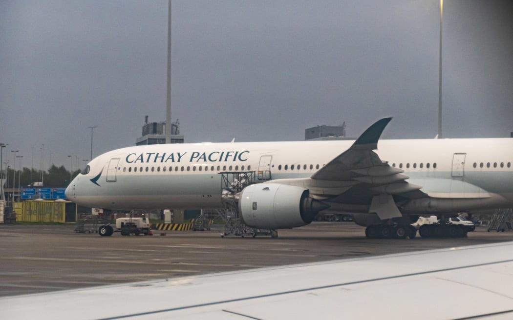 Cathay Pacific Airbus A350-1000 passenger aircraft spotted parked at Amsterdam Schiphol Airport. The wide body airplane has the registration tail number B-LXM while is powered by 2x Rolls Royce RR Trent XWB-97 jet engines. Cathay Pacific is the flag carrier airline of Hong Kong with a fleet of 178 aircraft, member of Oneworld aviation alliance group. As of September 2024 according to media, Cathay Pacific grounds A350 fleet after engine failure for an inspection to all 48 widebody planes for a specific Rolls-Royce engine component. EU and EASA the Union's aviation safety agency will order A350 inspection after the engine fire. Amsterdam Schiphol, the Netherlands on April 2024 (Photo by Nicolas Economou/NurPhoto) (Photo by Nicolas Economou / NurPhoto via AFP)