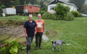 Kimberlee and Gary Whitehead at their home in the Far North’s Pupuke Valley as last week’s flood subsides.