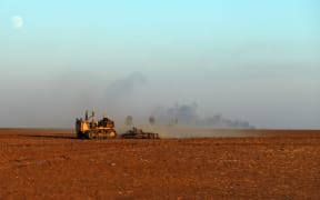 A farmer ploughs a wheat field in the countryside of Syria's breadbasket region. Hasakeh has been hard hit by low rainfall. Farmers in the region have had dismal wheat harvests, raising alarm about food security in a war-torn country where 60 percent of people struggle to buy food.