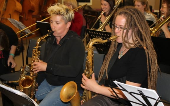 A photo of Lana Law (far left) who is the musical director of the All Girl Big Band.