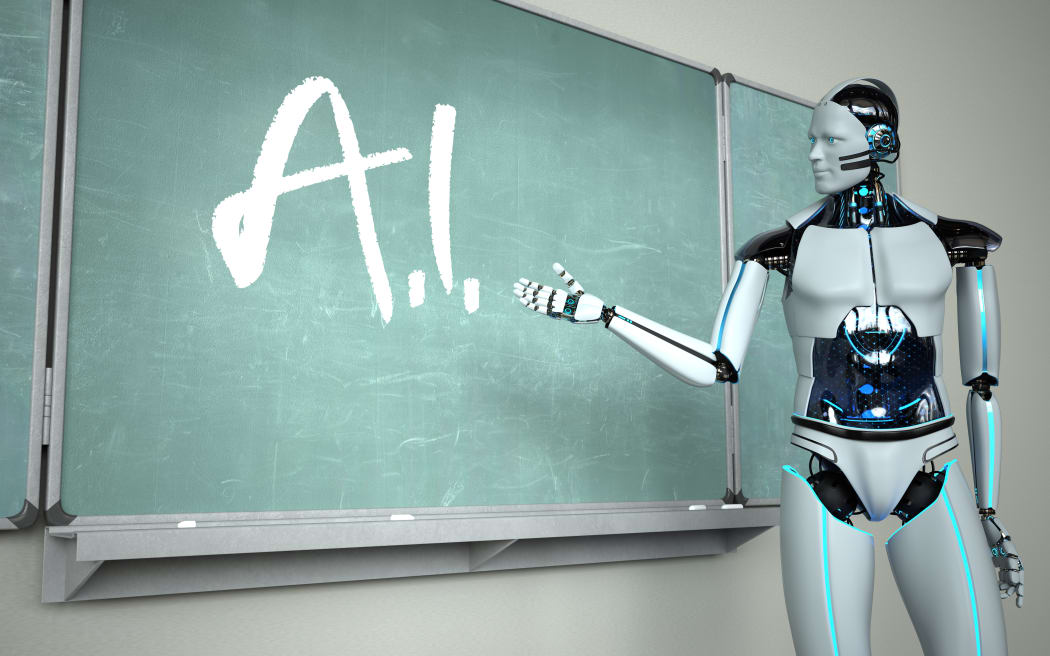Humanoid robot in the classroom with a green chalkboard.