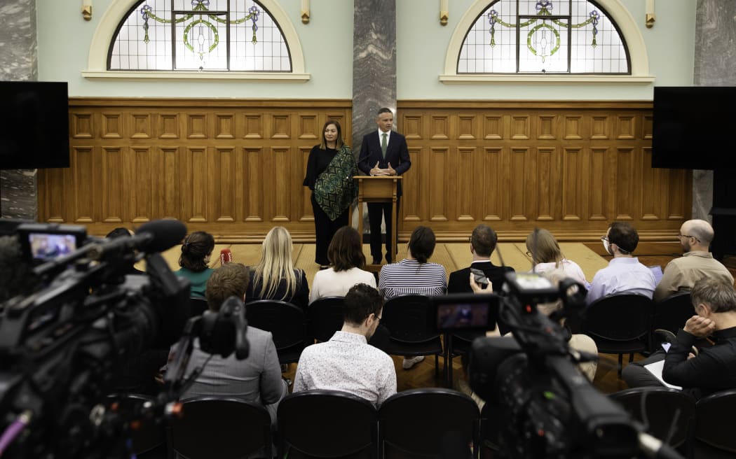 James Shaw, right, announces his resignation as Green Party co-leader at a media conference with co-leader Marama Davidson at Parliament on 30 January 2024.