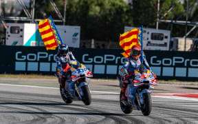 Marc Marquez (L) and Alex Marquez.