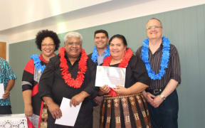 Lingisou Sinaki Teulilo receiving his certificate.