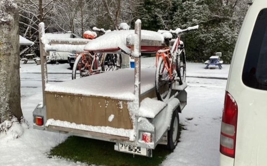 Snow coverrs bikes on a trailer in Dunedin Thursday 6 October 2022