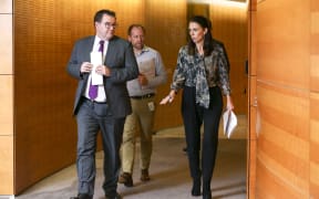 Prime Minister Jacinda Ardern and Finance Minister Grant Robertson arrive at a press conference at Parliament.
