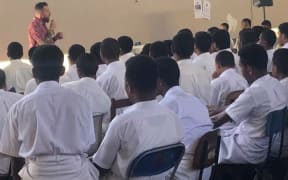 US Special Agent Billy Lewis addresses students in Suva.
