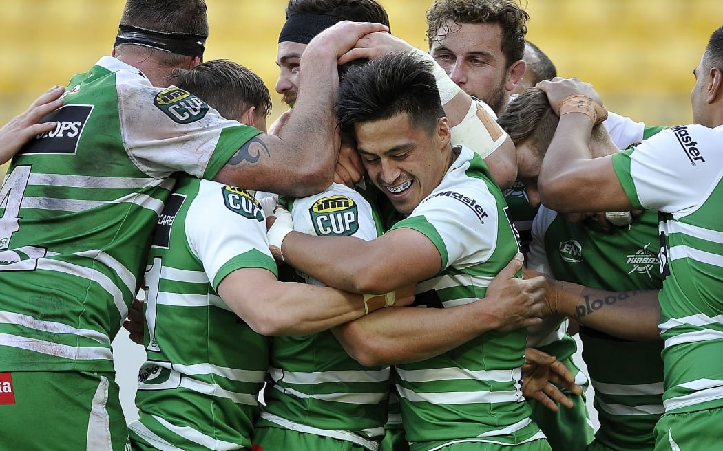 The Manawatu Turbos celebrate a try during their win over Wellington