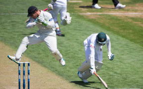 Bangladesh's Shakib Al Hasan makes his ground as BJ Watling takes a return.
