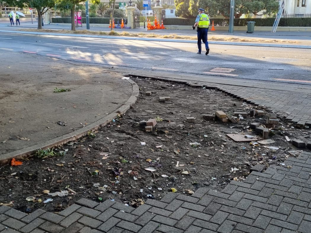 A ripped-up pavement outside Parliament is seen on 3 March, 2022, a day after the bricks were used as projectiles, which protesters hurled at police.