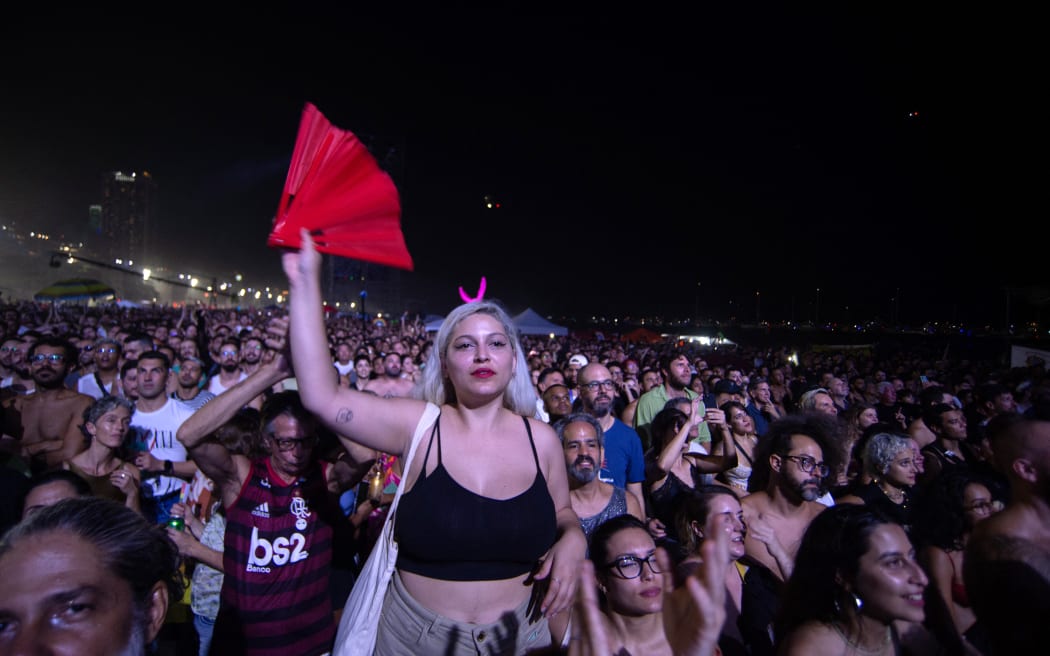 Fans watch US pop star Madonna perform during a free concert at Copacabana beach in Rio de Janeiro, Brazil, on May 4, 2024. . Madonna ended her “The Celebration Tour” with a performance attended by some 1.5 million enthusiastic fans. (Photo by TERCIO TEIXEIRA / AFP)