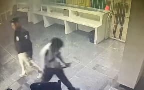 A screen grab obtained from a handout surveillance video released by Mexico's National Institute of Migration which shows guards leaving as flames engulf an immigration detention facility in Ciudad Juarez, northern Mexico, on 27 March 2023.