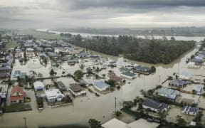 The flooded southeastern approach to Westport under flood in July 2021, with the Buller River in the background.