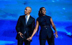 Former President Barack Obama and former first lady Michelle Obama appear on stage on the second night of the Democratic National Convention at the United Center in Chicago on August 20, 2024.