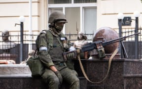 A member of Wagner group stands guard in Rostov-on-Don, on June 24, 2023.