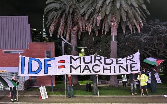 Protesters gather outside the Jerry Seinfeld live show in Auckland.