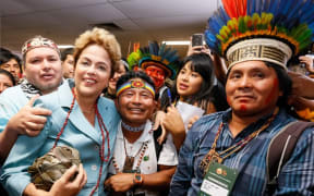 Brazilian president Dilma Rousseff holds a ki, or woven flax ball, in Brasilia.
