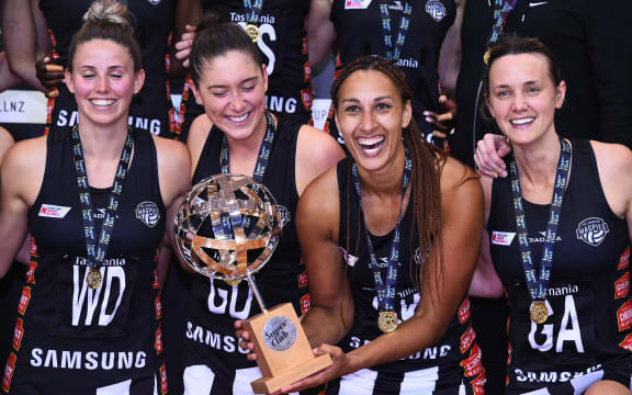 Collingwood Magpies celebrate winning the Final of 2019 Super Club Netball Tournament. Geva Mentor holds the Cup.