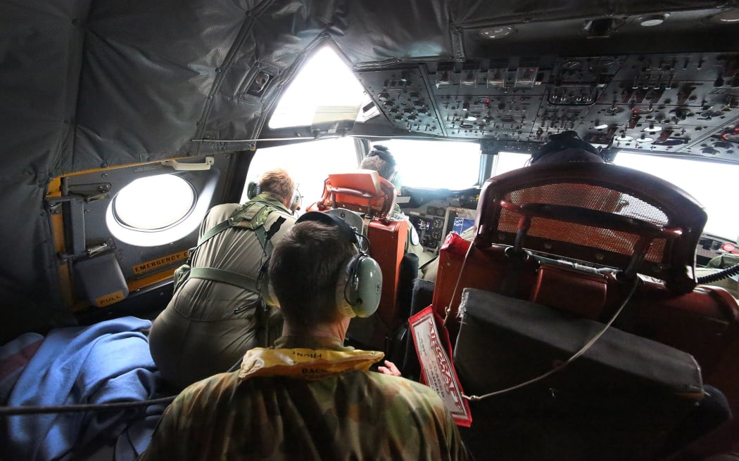 Crew of an Australian Air Force Orion searching in the southern Indian Ocean.