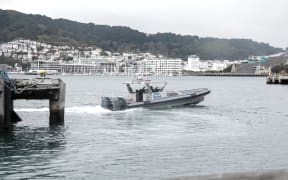 A police boat at Wellington Harbour, where authorities are searching for a man who is believed to have fallen overboard, on 24 May, 2024.