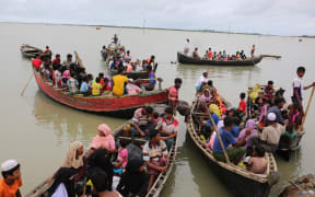 Rohingya people, fled from ongoing military operation in Myanmar Rakhain state, ride on boat at Shah Pori Island to go to refugee camp in Shah Pori Island in Bangladesh on October 07, 2017.
Rohinngya people fled continuing in Bangladesh.