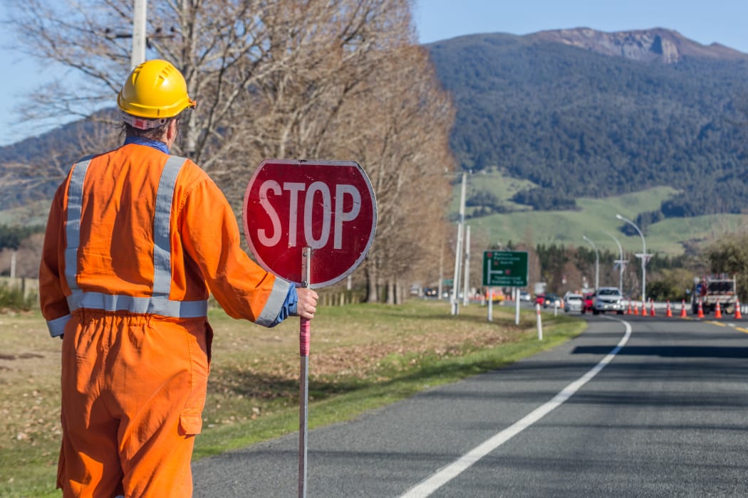Signs repairs road and worker