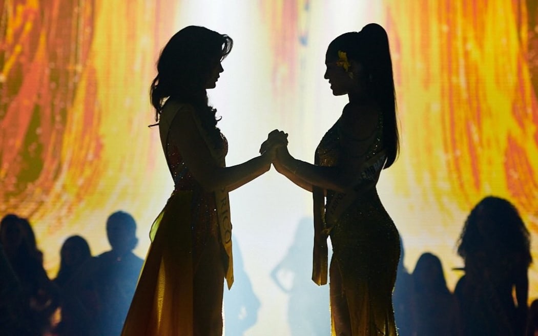 Puerto Rico's Ashley Melendez stands hand in hand with Samoa's Haylani Kuruppu awaiting the announcement of Miss Global 2024.