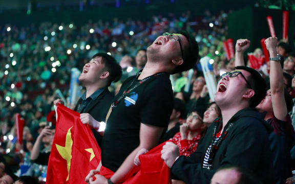 LGD fans react during the Dota 2 grand final match between PSG.LGD and OG on Day 6 of The International 2018 at Rogers Arena on August 25, 2018 in Vancouver, Canada.