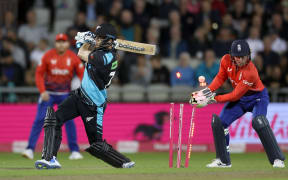 Mitchell Santner of New Zealand is bowled out by Liam Livingstone of England in the second T20 International cricket match at Old Trafford.