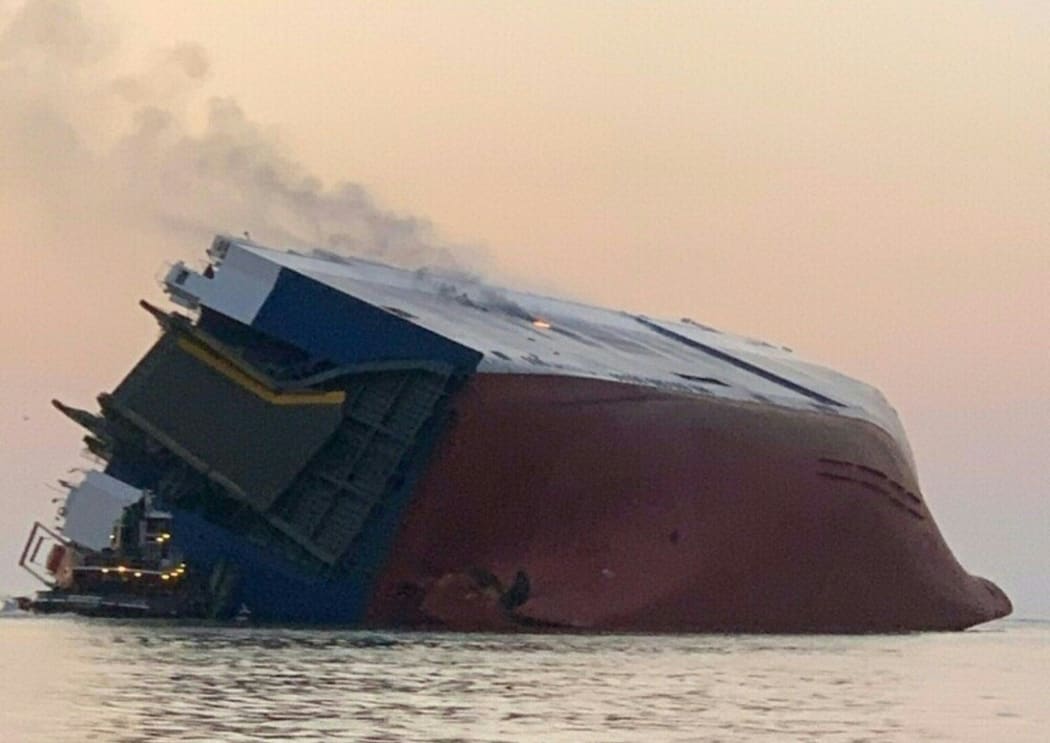 A US Coast Guard photo shows Coast Guard and port partners responding September 8, 2019 after the 656-foot vehicle carrier "Golden Ray" overturned in the St. Simons Sound near Brunswick, Georgia.