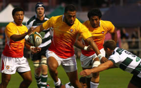 Nottingham RFC v Tonga. Telusa Veainu skips through an attempted tackle from Nottingham scrum-half Darryl Veenendaal. 2015